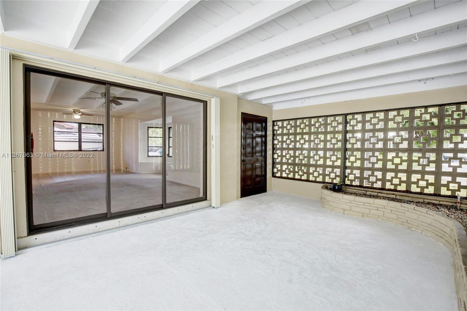 8751 Ridgeland Drive Cutler Bay, FL 33157 - Photo 4 of 26 en empty room with large windows