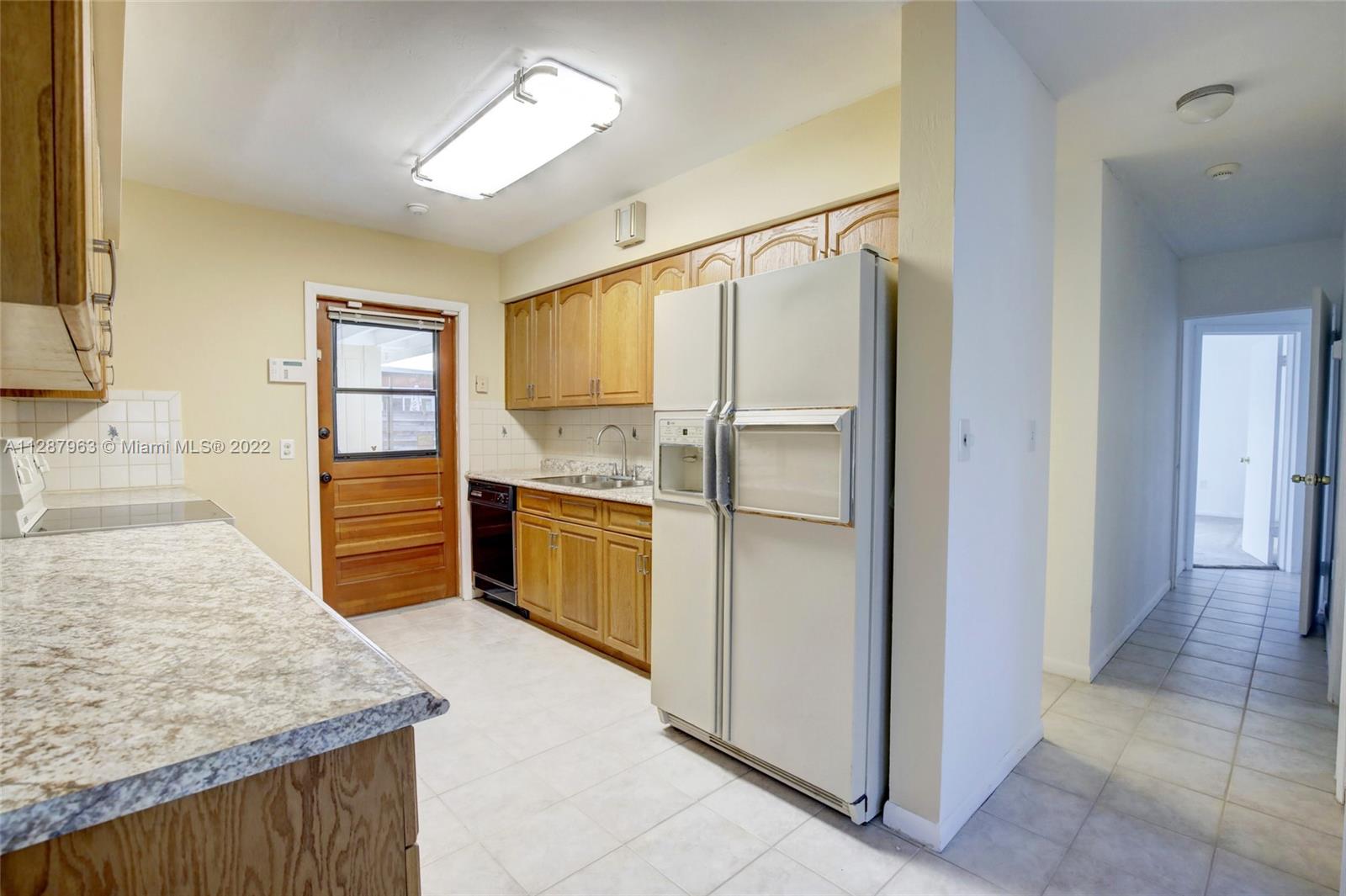 8751 Ridgeland Drive Cutler Bay, FL 33157 - Photo 8 of 26 a kitchen with stainless steel appliances granite countertop a refrigerator and a sink