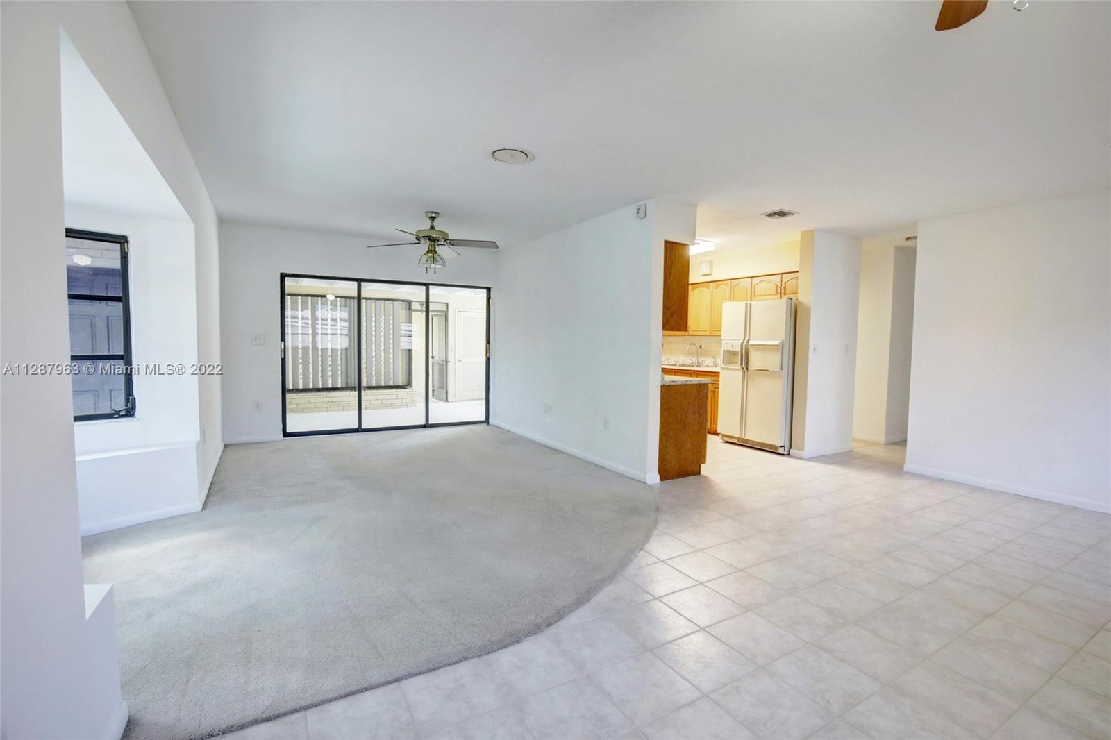 8751 Ridgeland Drive Cutler Bay, FL 33157 - Photo 10 of 26 an empty room with windows and fireplace