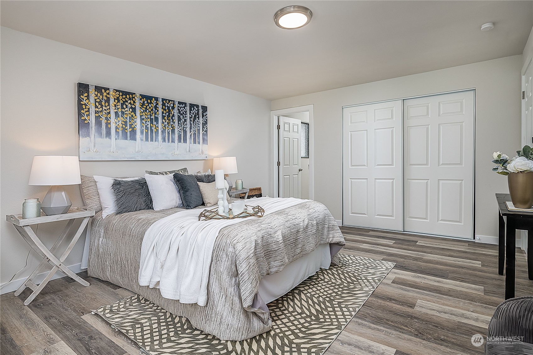 3024 Northeast 7th Street Renton, WA 98056 - Photo 14 of 23 a spacious bedroom with a bed and window