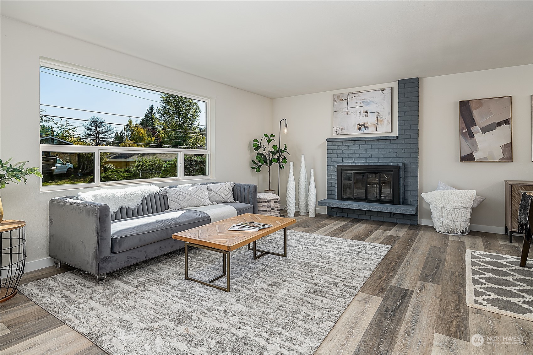 3024 Northeast 7th Street Renton, WA 98056 - Photo 5 of 23 a living room with furniture and a fireplace