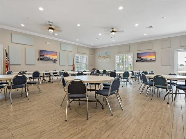 a view of a livingroom with workspace and a bookshelf