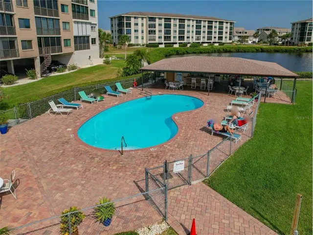 a view of a patio with a table and chairs