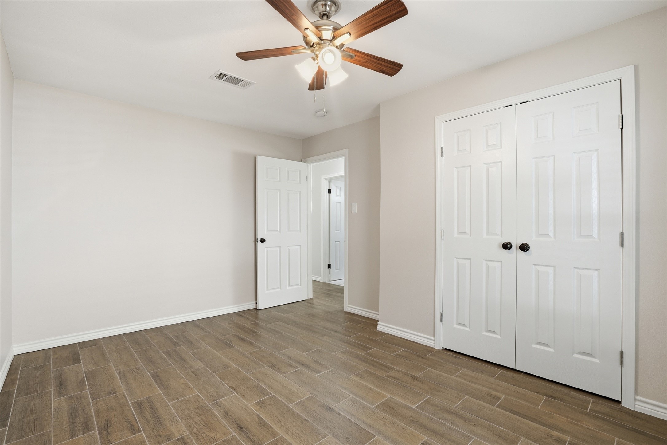 6518 Paris Street Houston, TX 77021 - Photo 15 of 23 wooden floor in an empty room