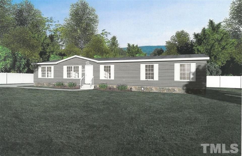 3013 Edgemont Road Wendell, NC 27591 - Photo 1 of 3 a front view of a house with a garden