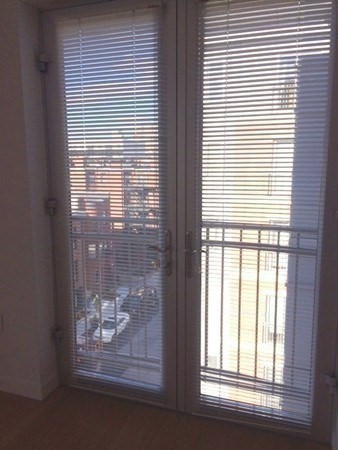 16 Miner Street, Unit 510 Boston, MA 02215 - Photo 13 of 26 a glass window with a glass door