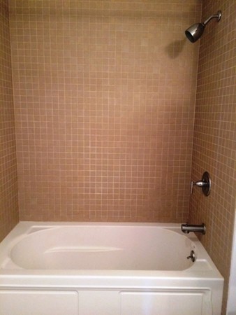 16 Miner Street, Unit 510 Boston, MA 02215 - Photo 15 of 26 a bathroom with a bathtub
