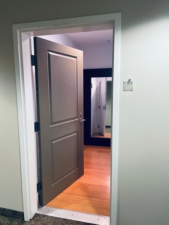 16 Miner Street, Unit 510 Boston, MA 02215 - Photo 5 of 26 a view of a hallway with a room