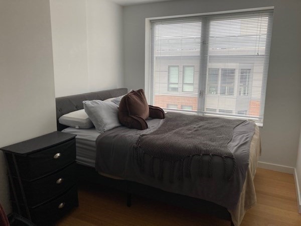 16 Miner Street, Unit 510 Boston, MA 02215 - Photo 7 of 26 a bedroom with a bed and a window