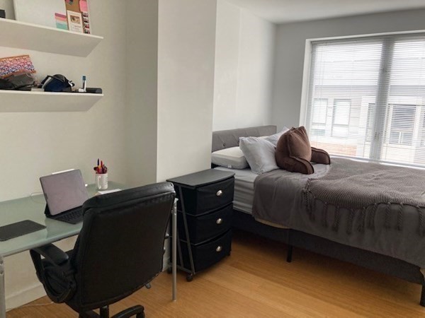 16 Miner Street, Unit 510 Boston, MA 02215 - Photo 8 of 26 a bedroom with a bed and a window