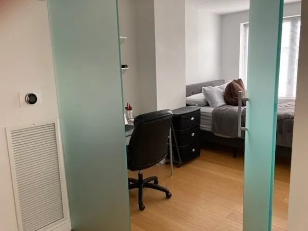 a workspace with furniture and a window