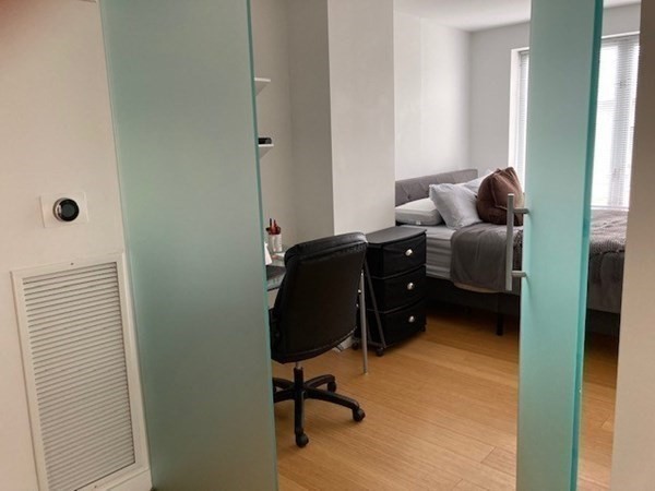 16 Miner Street, Unit 510 Boston, MA 02215 - Photo 9 of 26 a workspace with furniture and a window