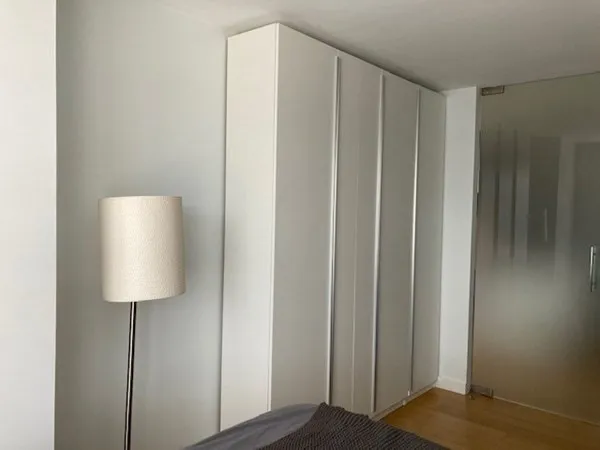 a view of a bathroom with wooden floor