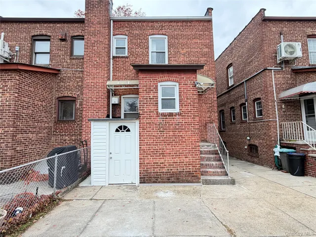 a front view of a house with parking space
