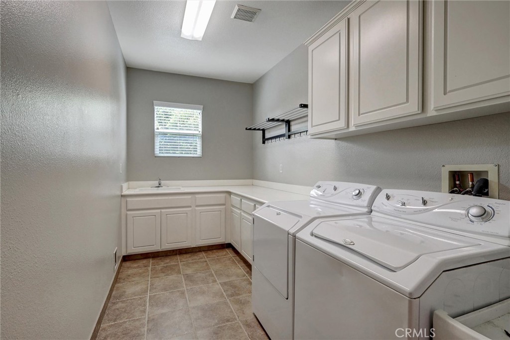 13387 Babbling Brook Way Eastvale, CA 92880 - Photo 43 of 75 Upstairs laundry room