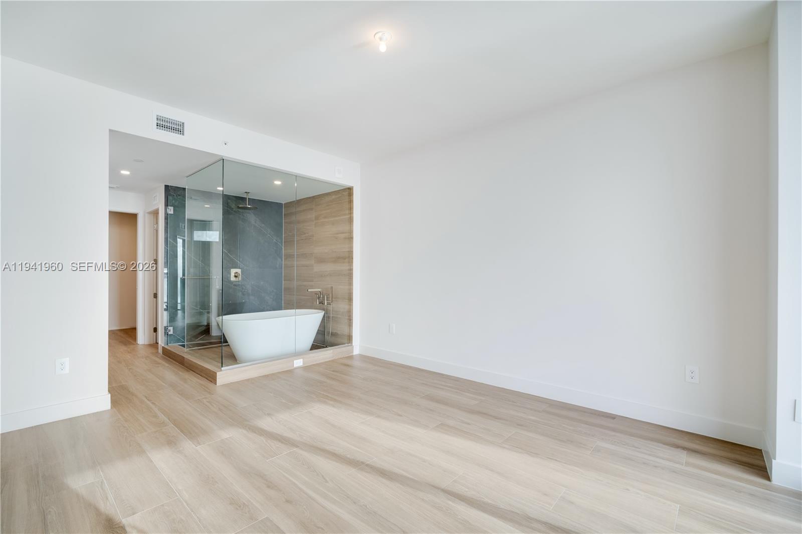 700 Northeast 24th Street, Unit 4203 Miami, FL 33137 - Photo 14 of 51 a bathroom with a toilet and a shower