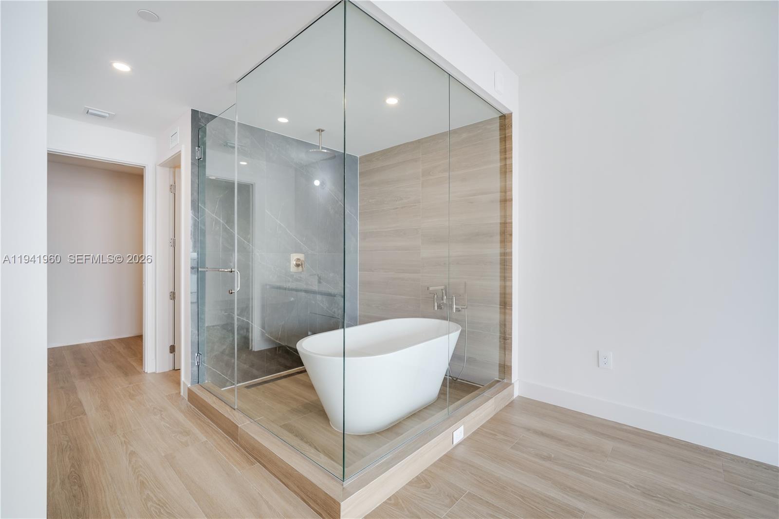 700 Northeast 24th Street, Unit 4203 Miami, FL 33137 - Photo 19 of 51 a bathroom with a bathtub and shower