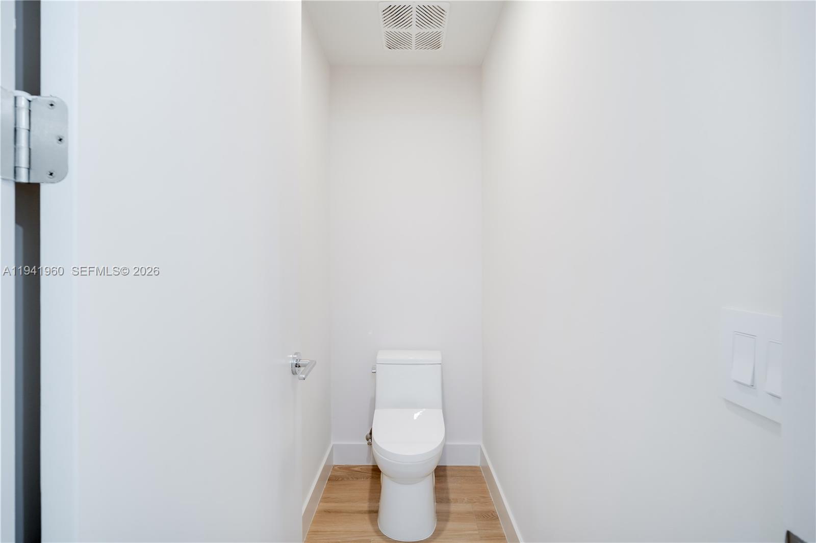 700 Northeast 24th Street, Unit 4203 Miami, FL 33137 - Photo 22 of 51 a white toilet sitting next to a white wall