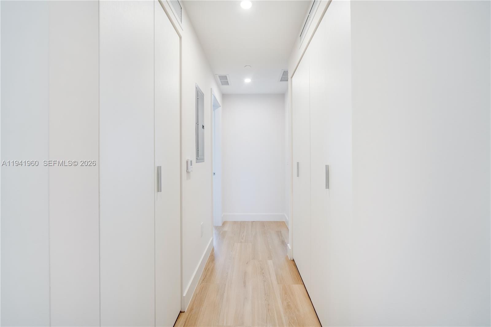 700 Northeast 24th Street, Unit 4203 Miami, FL 33137 - Photo 29 of 51 a view of a hallway with wooden floor