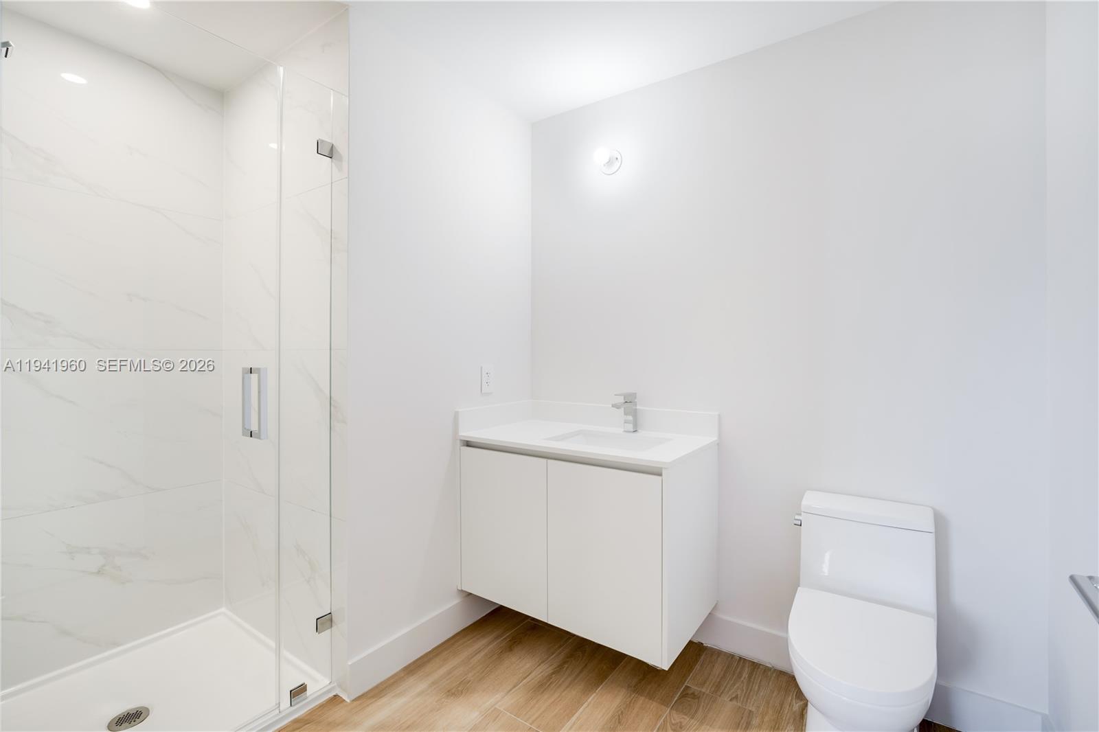 700 Northeast 24th Street, Unit 4203 Miami, FL 33137 - Photo 33 of 51 a bathroom with a sink a toilet and shower