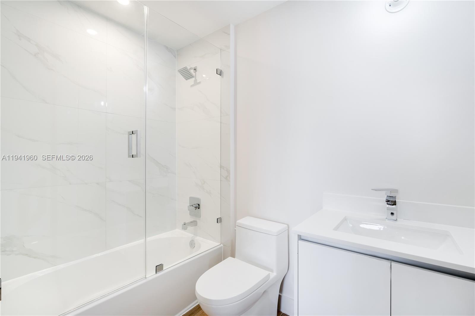 700 Northeast 24th Street, Unit 4203 Miami, FL 33137 - Photo 36 of 51 a bathroom with a sink toilet and shower