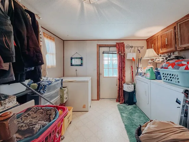 a bed room with a bed and a window