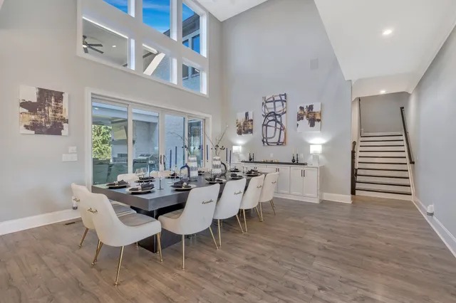 a view of a livingroom with workspace and a window