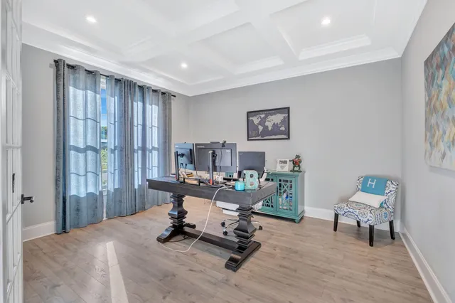 a white bath tub sitting in a bathroom and mirror