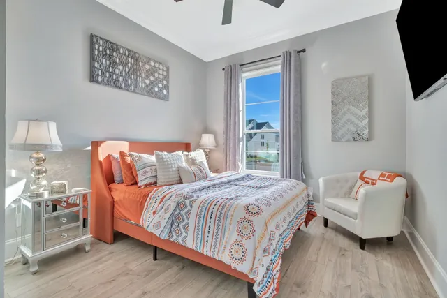 a kitchen with stainless steel appliances kitchen island granite countertop a sink and a stove top oven with wooden floor