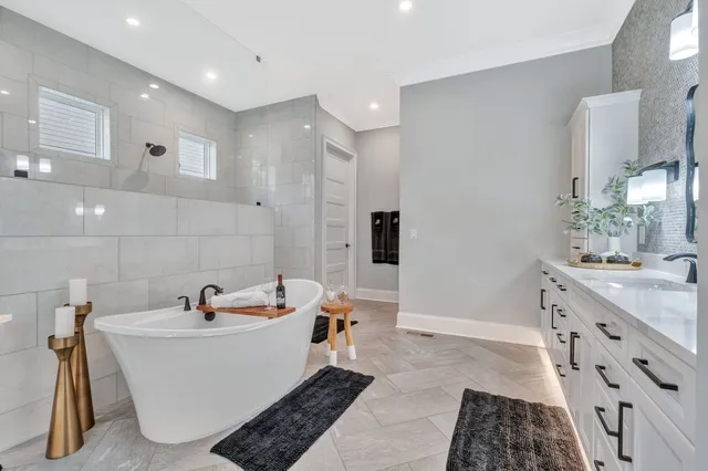 a bathroom with a sink mirror vanity and toilet