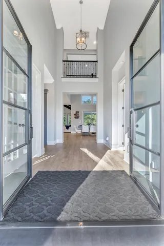 a kitchen with kitchen island granite countertop a sink a stove oven a counter space and cabinets