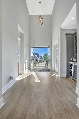 a dining room with furniture and wooden floor
