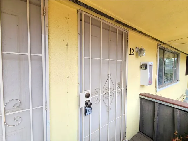 a bathroom with a shower and a sink