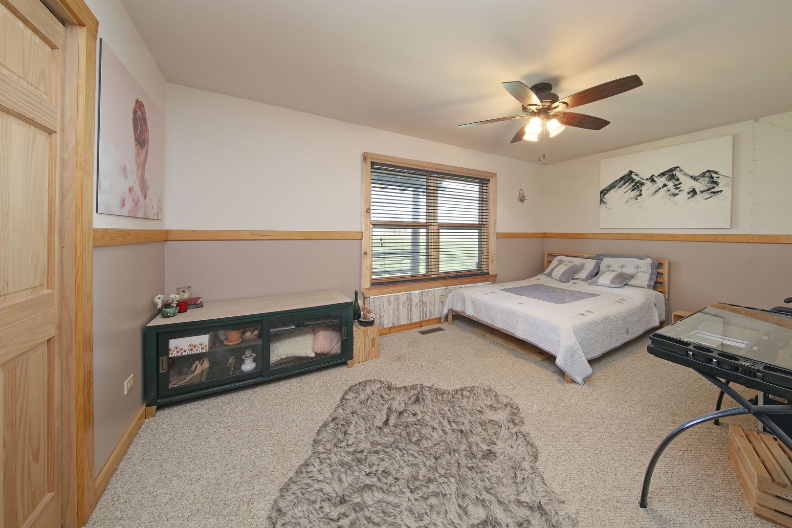 7730 South Holm Road Dwight, IL 60420 - Photo 11 of 22 a bedroom with a bed and a chandelier