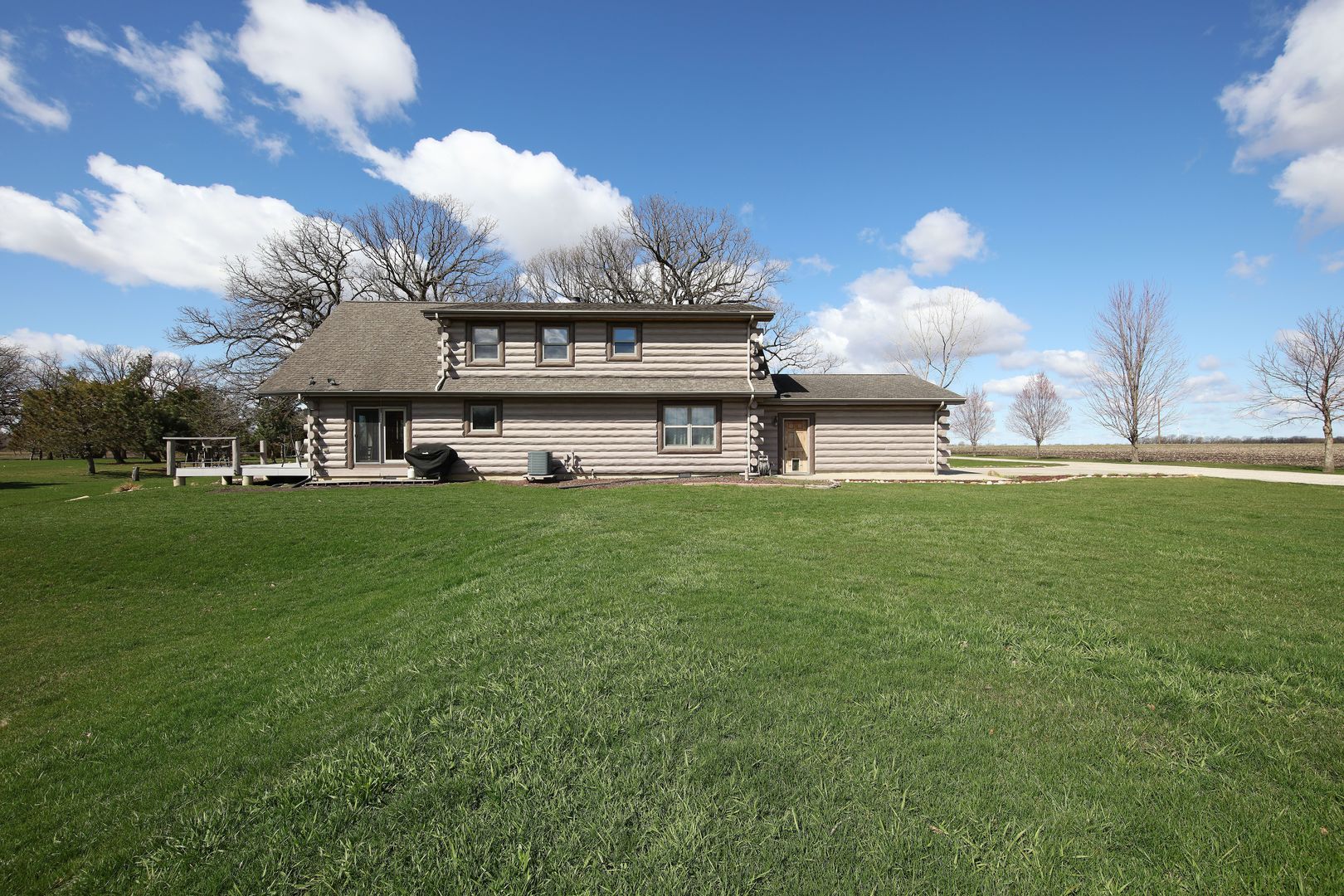 7730 South Holm Road Dwight, IL 60420 - Photo 21 of 22 a view of a big yard of the house and front view of a house