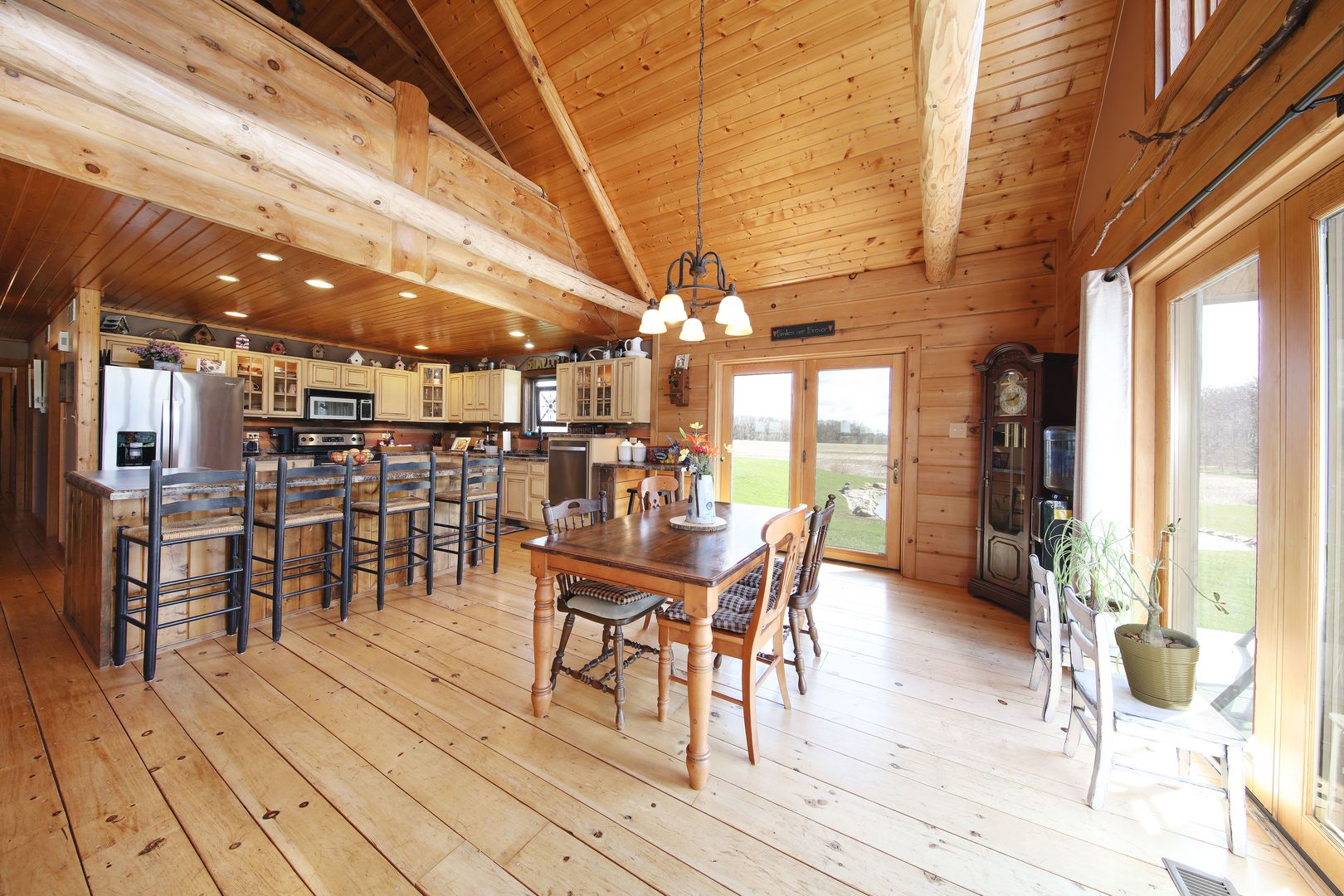 7730 South Holm Road Dwight, IL 60420 - Photo 6 of 22 a dining room with stainless steel appliances a dining table chairs and view of the kitchen
