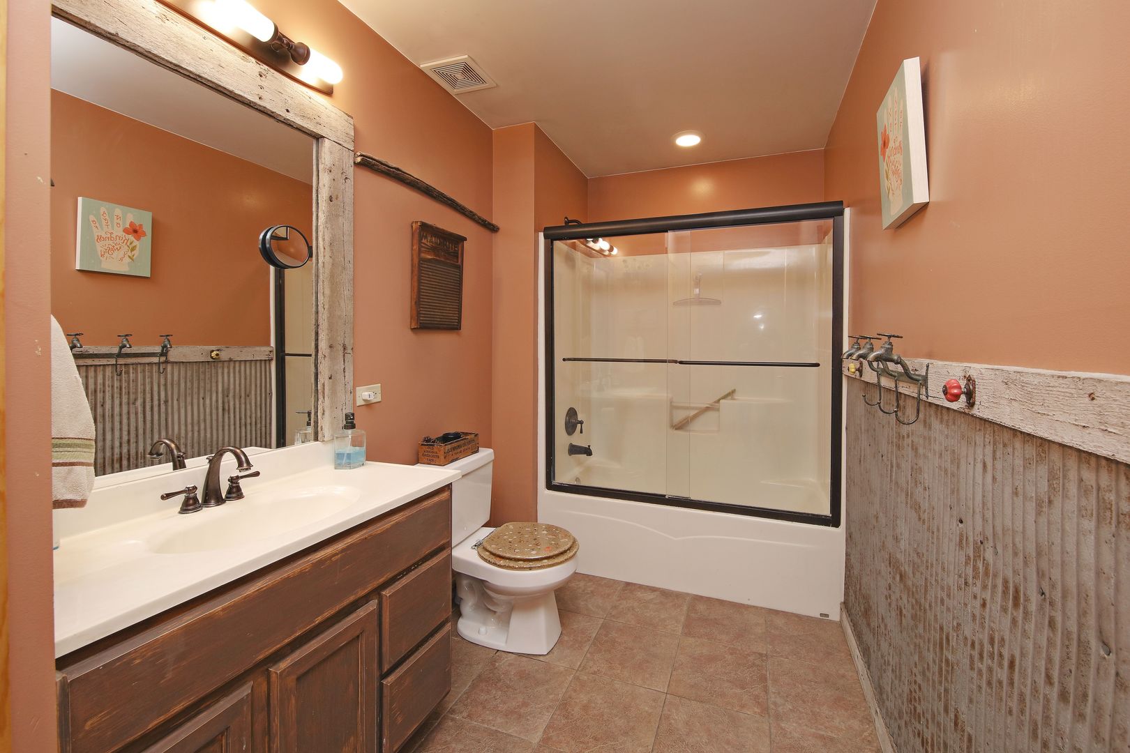 7730 South Holm Road Dwight, IL 60420 - Photo 10 of 22 a bathroom with a sink toilet and shower