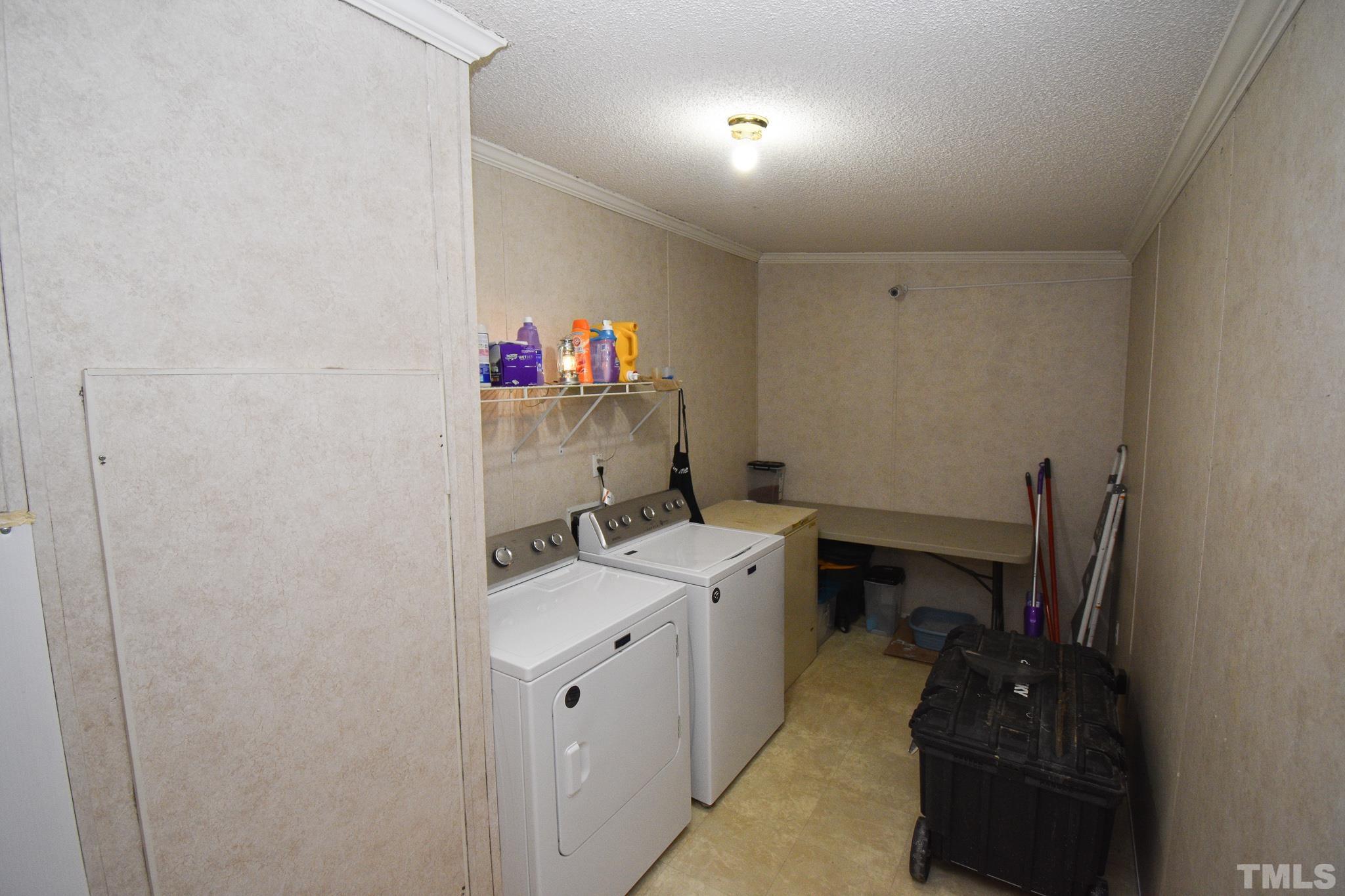 8484 South Creek Road Willow Spring, NC 27592 - Photo 10 of 33 a room with a sink and cabinets