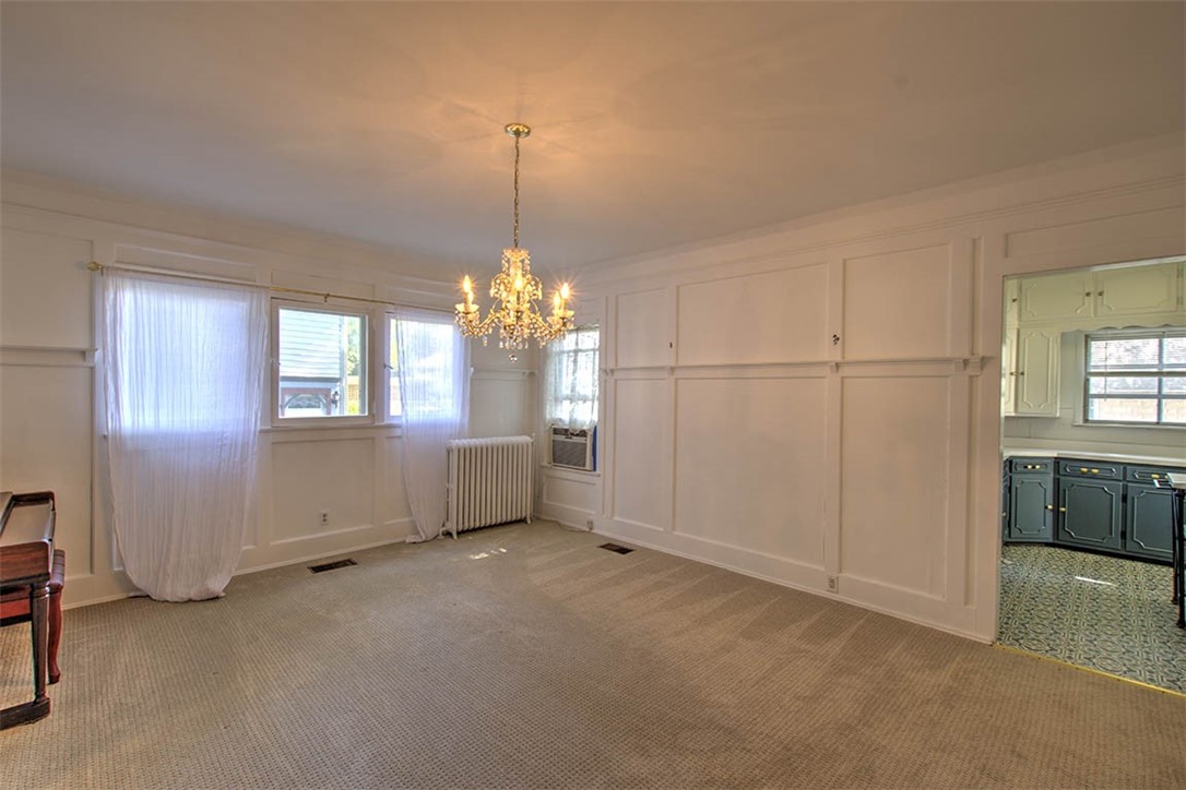 531 West William Street Decatur, IL 62522 - Photo 12 of 28 a view of a livingroom with a chandelier fan and windows