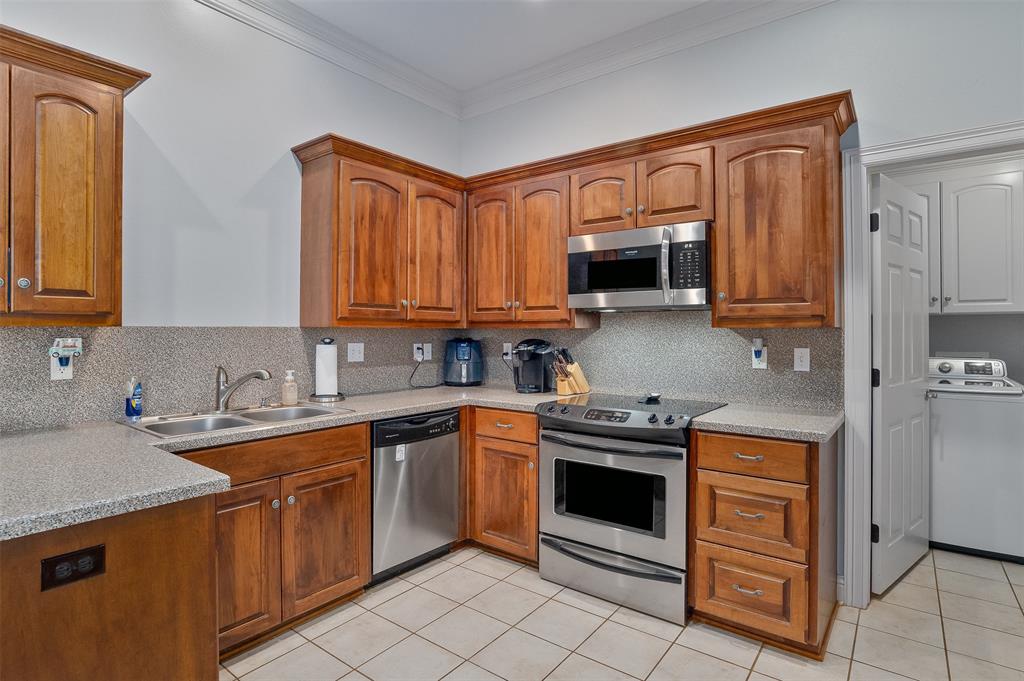 102 Fitzwilliam Street Haughton, LA 71037 - Photo 7 of 18 a kitchen with stainless steel appliances granite countertop a stove top oven a sink dishwasher and white cabinets