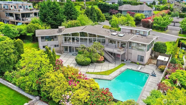 an aerial view of a house with a garden and plants
