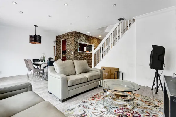 a living room with furniture and a lamp