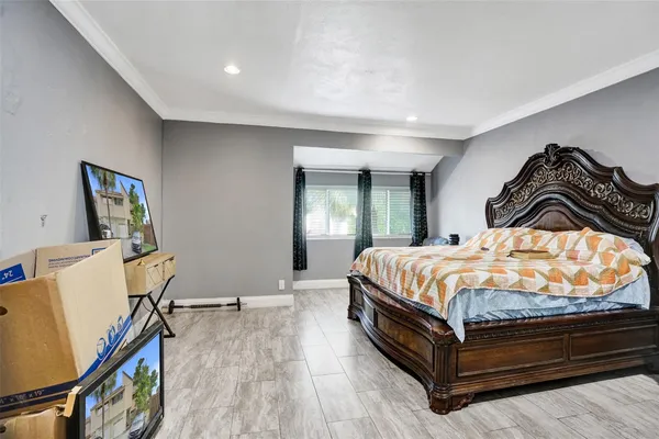 a bedroom with a bed and window