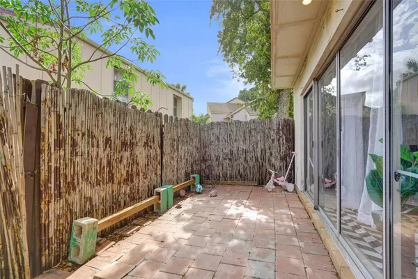 a view of a pathway with a wrought fence