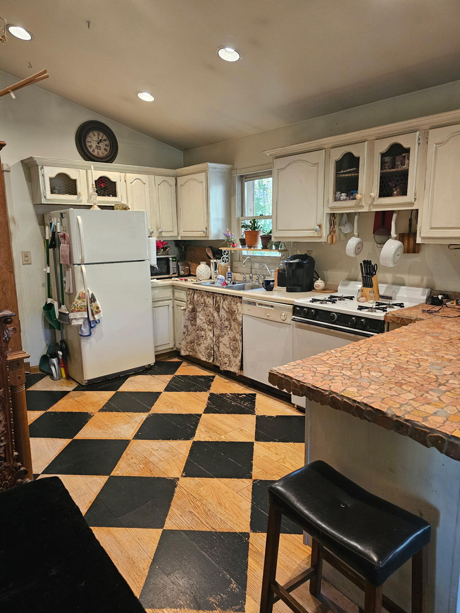 218 Chickadee Trail Michigan City, IN 46360 - Photo 13 of 40 a kitchen with a sink and a stove top oven