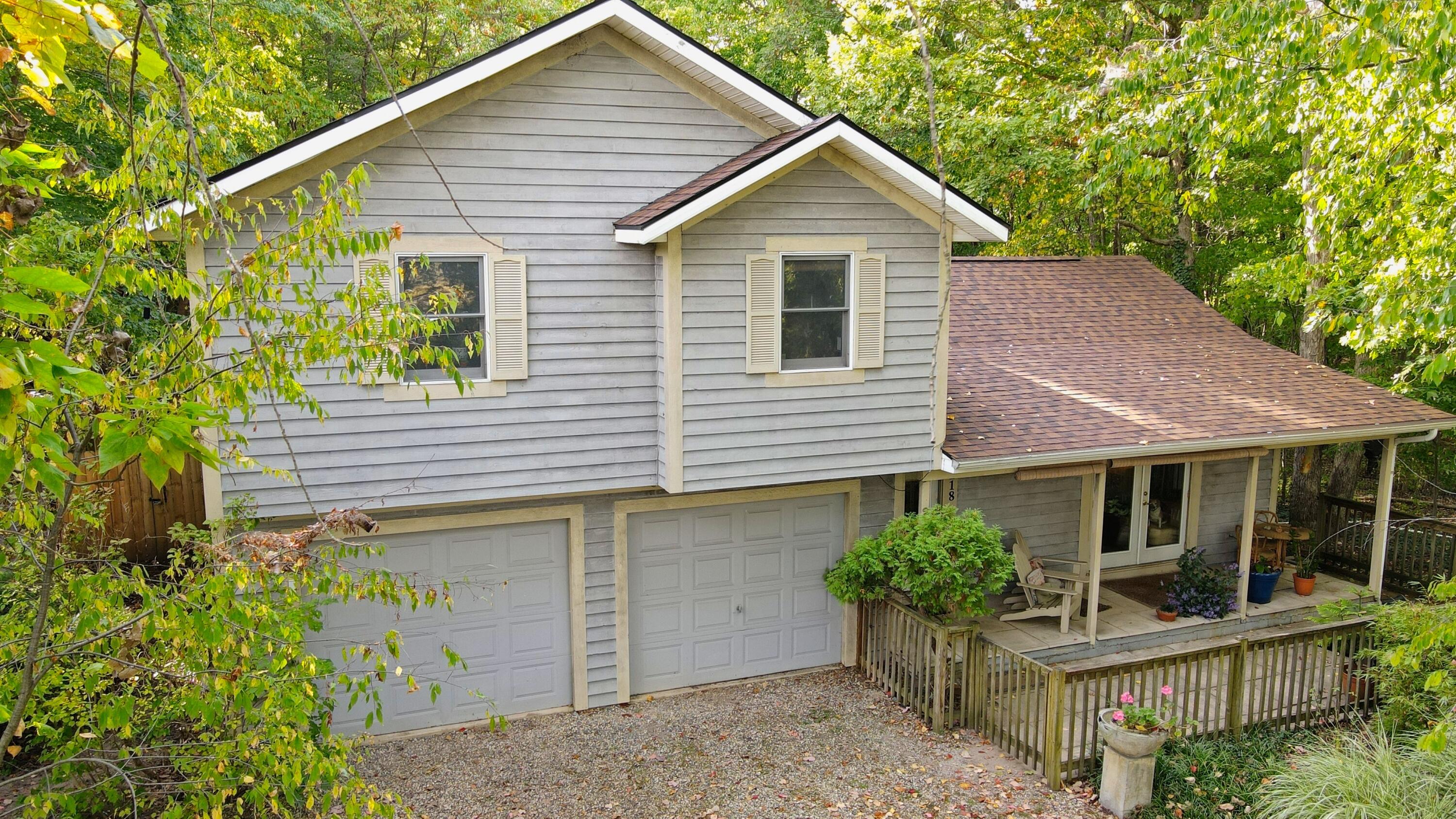 218 Chickadee Trail Michigan City, IN 46360 - Photo 2 of 40 a front view of a house with a yard and potted plants