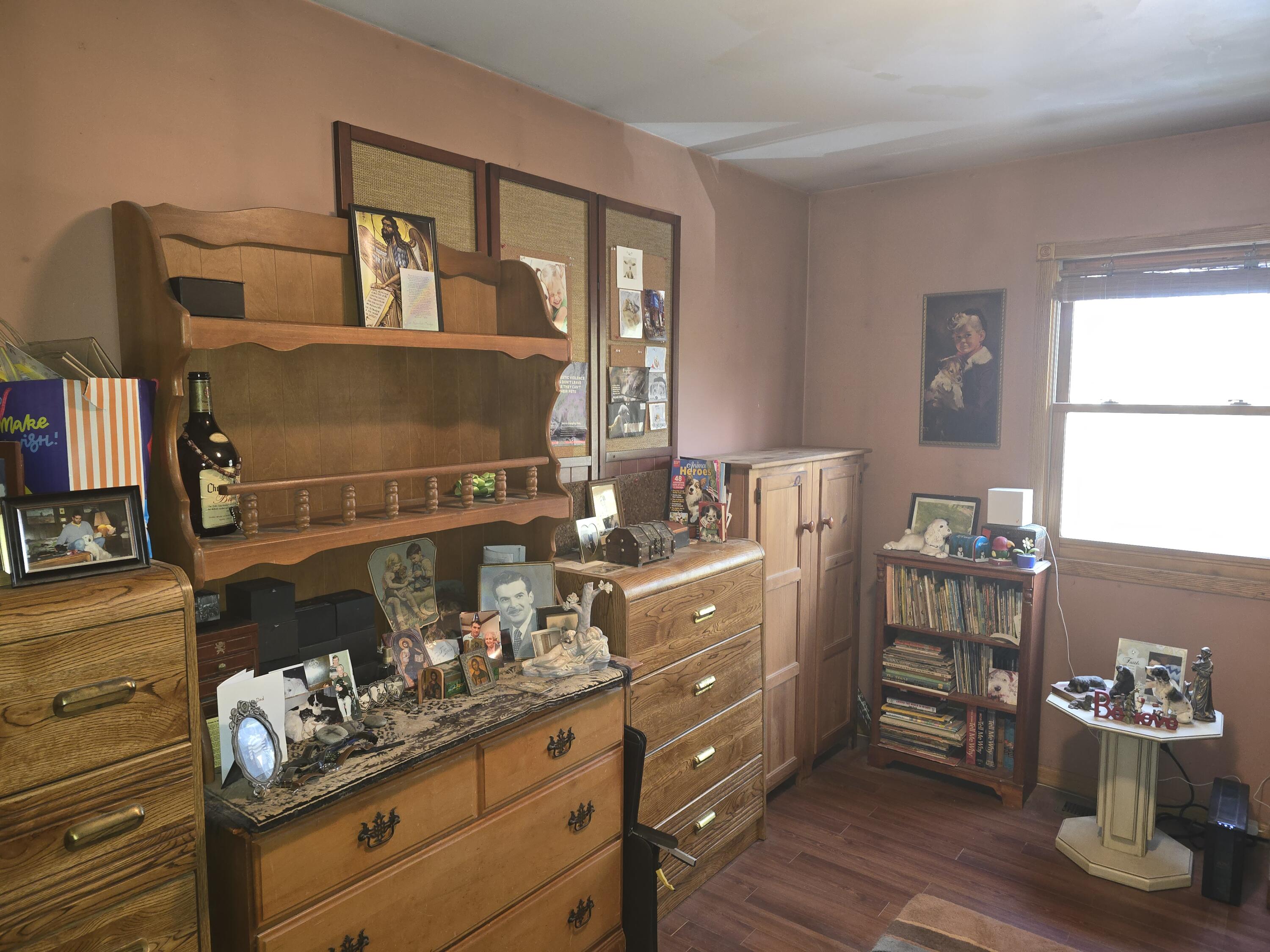 218 Chickadee Trail Michigan City, IN 46360 - Photo 21 of 40 a kitchen with a wooden floor and cabinets