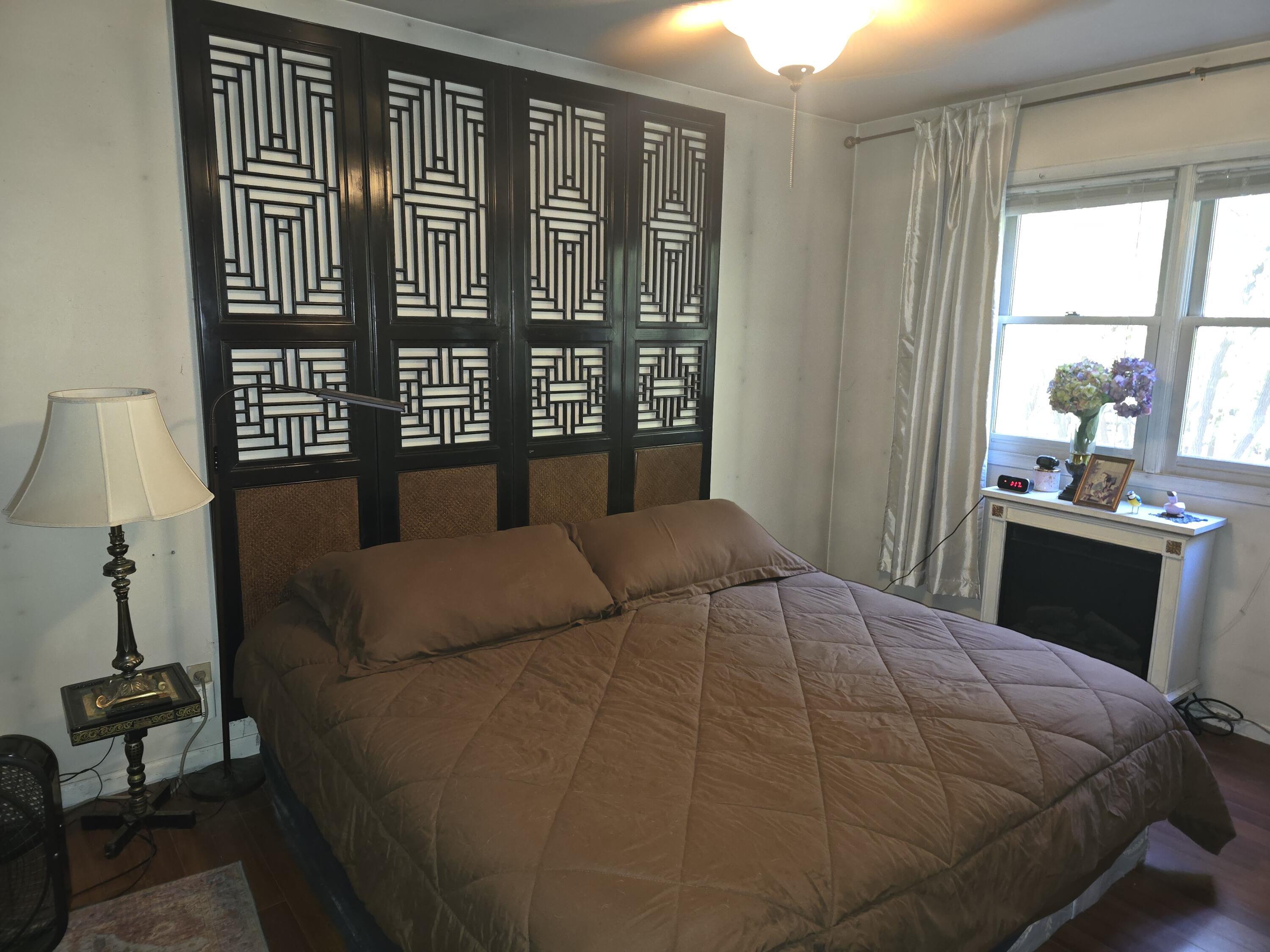 218 Chickadee Trail Michigan City, IN 46360 - Photo 26 of 40 a bedroom with a bed and wooden floor