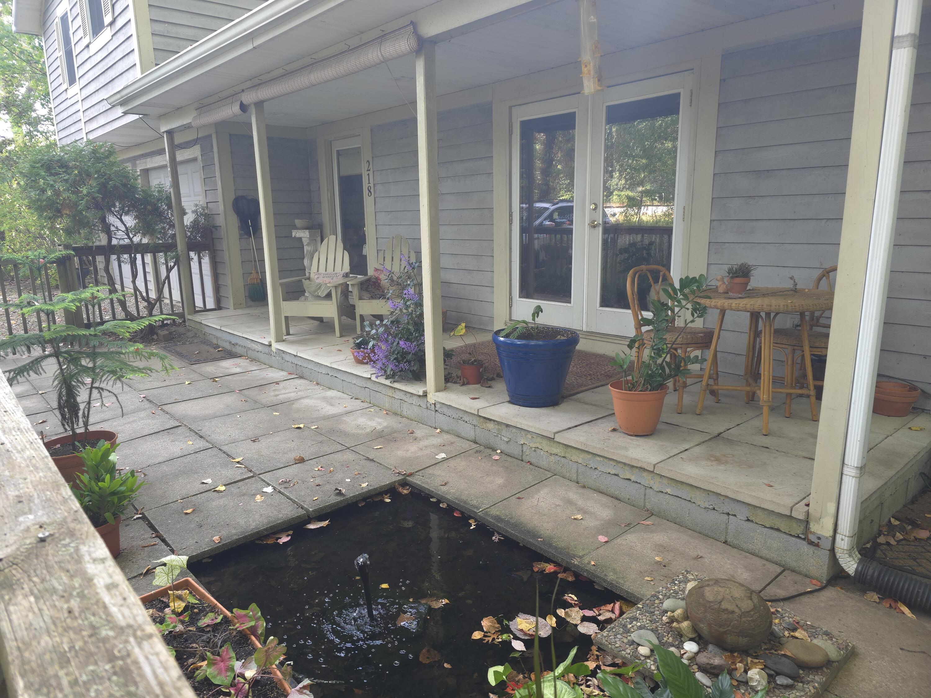 218 Chickadee Trail Michigan City, IN 46360 - Photo 8 of 40 a view of a balcony with chairs and tables