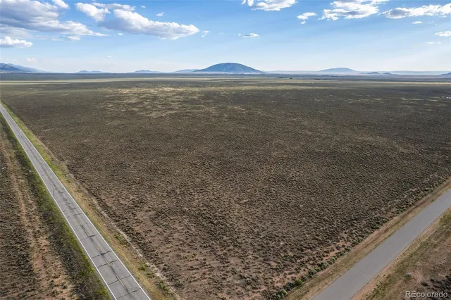 a view of an ocean beach and mountain